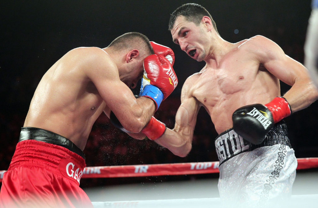 May 17, 2014, Inglewood, Ca. --- Viktor Postol (R) of Brovarsky, Ukraine stops Selcuk Aydin in the 11th round at The Forum in Inglewood,Ca. on Saturday. --- Photo Credit : Chris Farina - Top Rank (no other credit allowed) copyright 2014